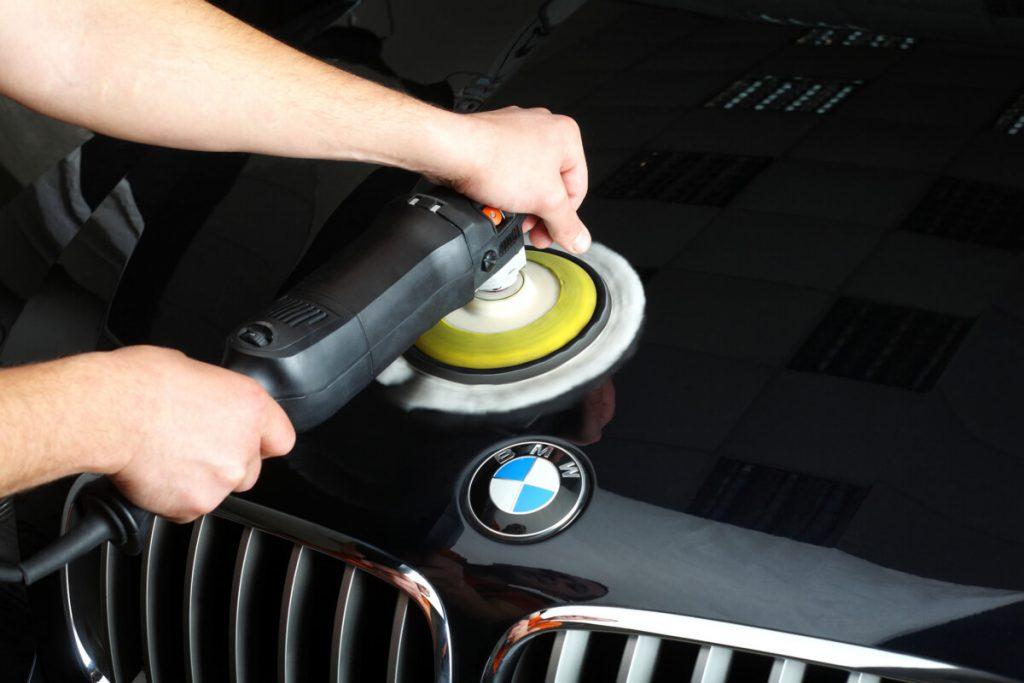 man polishing a BMW