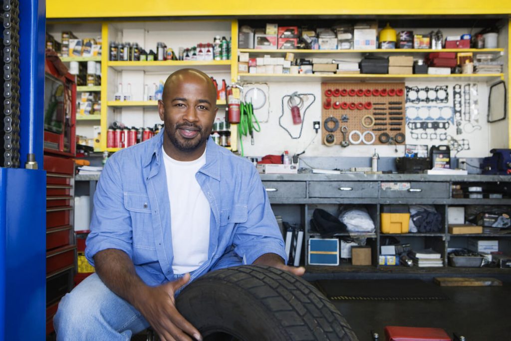 Auto mechanic in garage