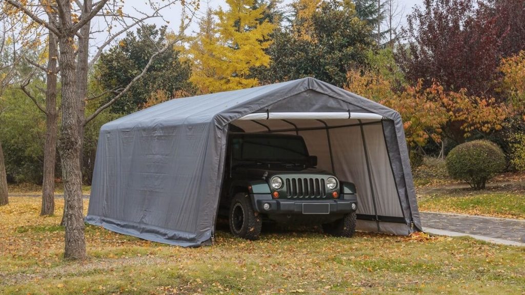 Jeep Wrangler under portable garage