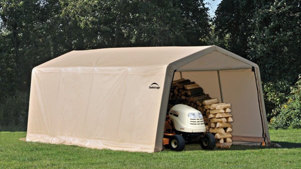 Tan portable garage with lawnmower